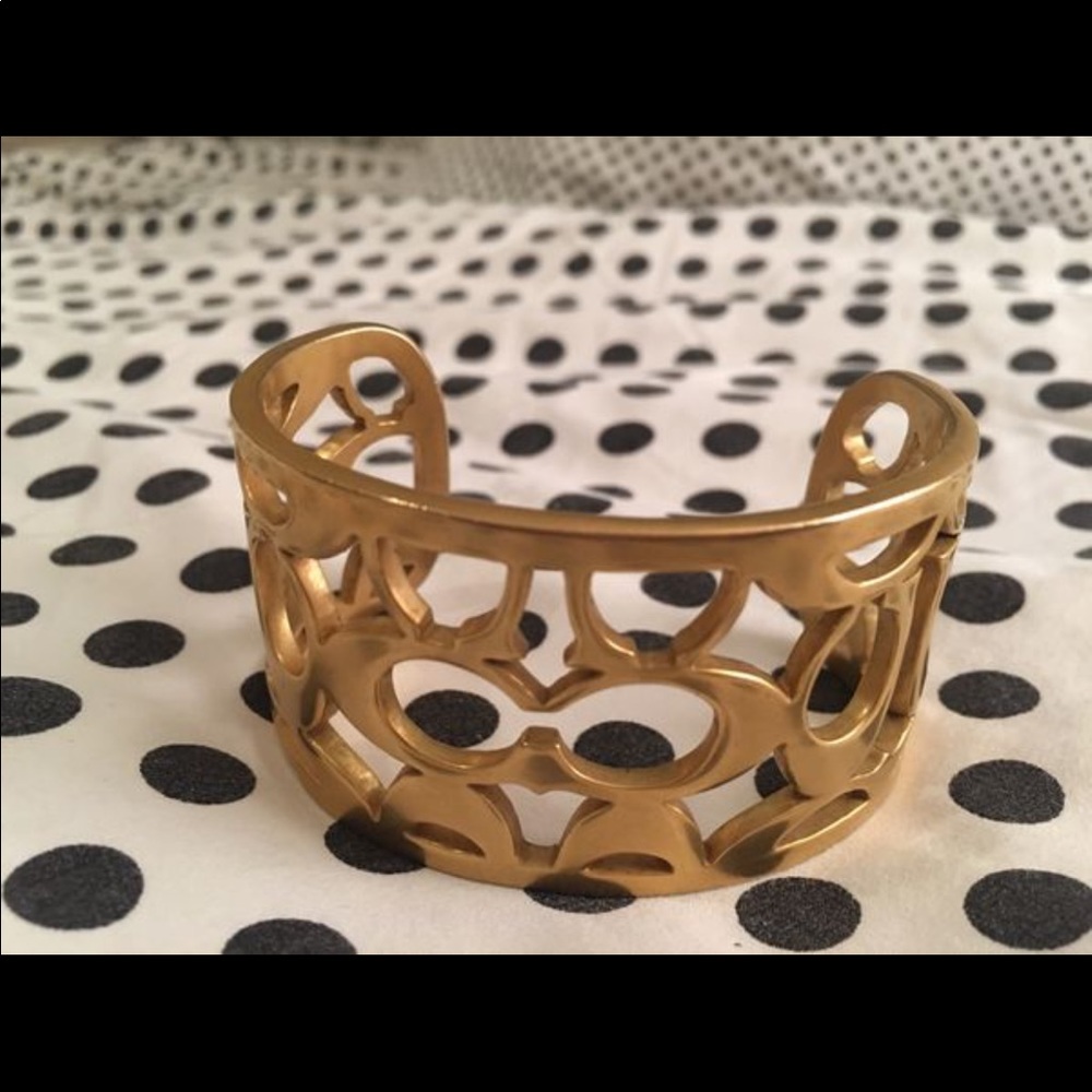 Gold tone coach bracelet